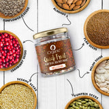 Ingredients of iOrganic Omega Seed Mix, a high protein snack, featuring almonds, sunflower, pumpkin, melon, and flax seeds with dried cranberries, promoting a balanced diet.