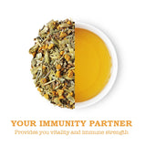 Loose turmeric spiced tea leaves and a brewed cup, highlighting its vibrant yellow color and immunity benefits.