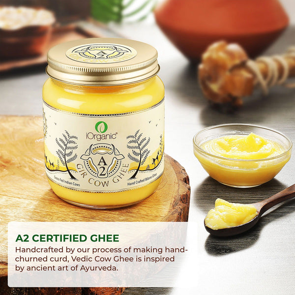 A2 Certified iOrganic Gir Cow Ghee jar beside a spoonful of ghee, underlining Ayurvedic health benefits and traditional culinary uses. Bilona Ghee