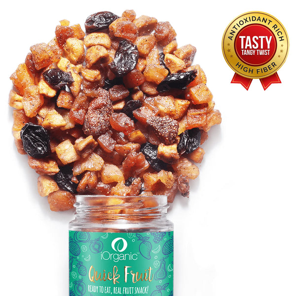 Close-up of iOrganic Chatpata Fruit Trail Mix spilling from the jar, a tasty and tangy snack packed with antioxidants and high fiber for healthy snacking.