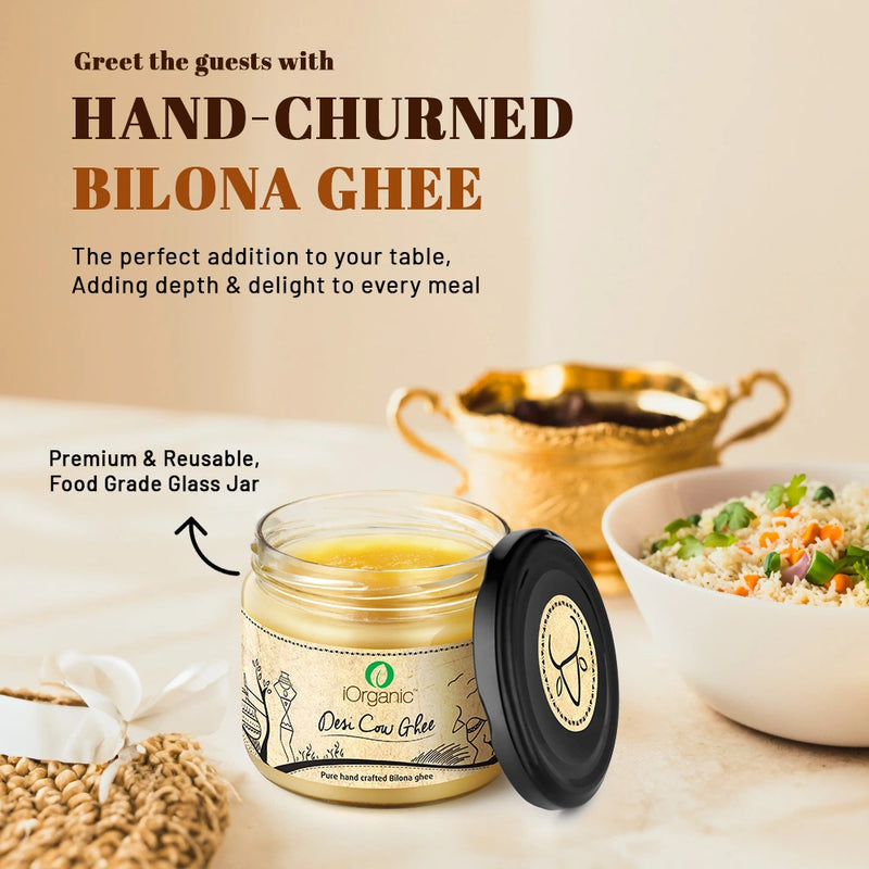 A jar of iOrganic A2 Desi Cow Ghee, made using the Ayurvedic bilona method from gir cow milk, displaying a rich, golden color with a granular texture, perfect for healthy cooking and improving overall wellness.