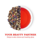 Loose Hibiscus Rose Tea leaves with a vibrant brewed cup, perfect for promoting skin health and radiance.