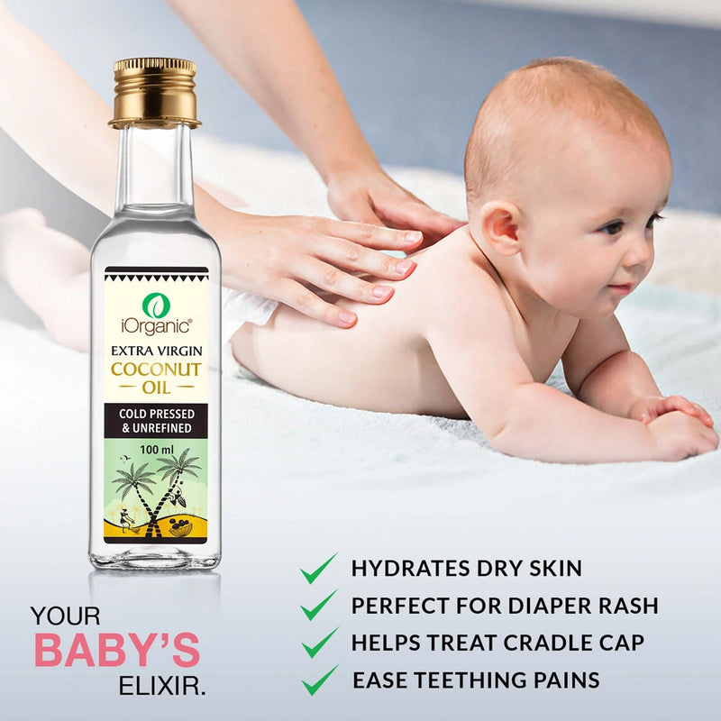 A bottle of iOrganic Virgin Coconut Oil beside a baby receiving a soothing massage.