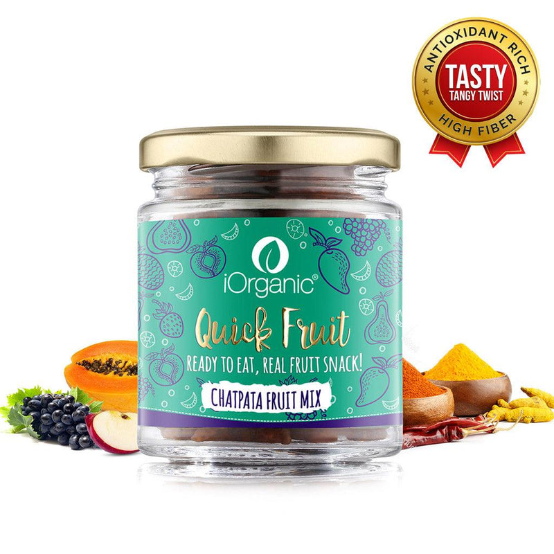 Jar of iOrganic Chatpata Fruit Trail Mix with tangy spices and tropical fruits in the background, the perfect tasty and tangy snack for a nutritious treat.