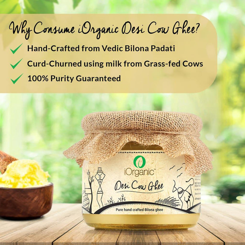 A jar of iOrganic A2 Desi Cow Ghee, made using the Ayurvedic bilona method from Sahiwal cow milk, displaying a rich, golden color with a granular texture, perfect for healthy cooking and improving overall wellness.
