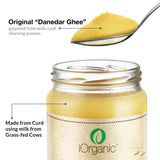 Open jar of iOrganic A2 Desi Cow Ghee with a spoonful of 'Danedar Ghee,' annotated to highlight the authentic Ayurvedic churning process from curd of grass-fed Sahiwal cows, ensuring a granular and nutrient-rich cooking staple.