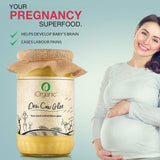 iOrganic A2 Desi Cow Ghee presented as a superfood for pregnancy, supporting baby's brain development, digestive health, and labor pain relief, shown with a smiling pregnant woman.