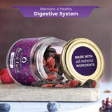 Tilted jar of iOrganic Verry Berry Mix showcasing the rich texture and variety of dried berries, with a background suggesting a healthy digestive system.