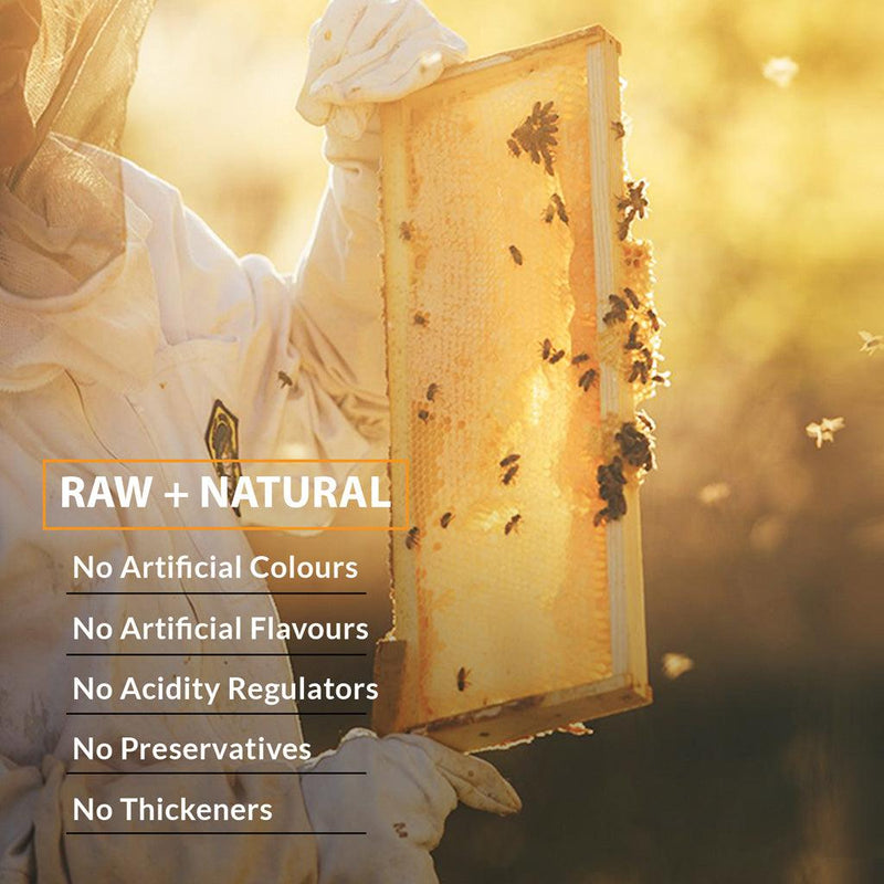 Beekeeper harvesting iOrganic Raw Acacia Honey, emphasizing the product's natural and unprocessed quality, with no additives, straight from Kashmir Valley
